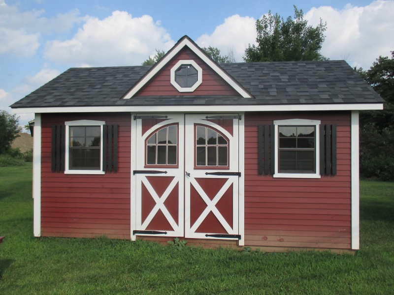 10x16 Manor Deluxe Shed, Red Pine Clapboard siding, Black roof, White trim, Optional Gable Vents and Carriage Doors, list price $5,357.50, DISPLAY UNIT $4,821,30 Honey Brook